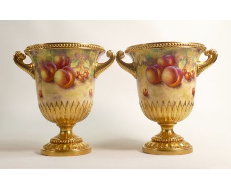Superb pair of Royal Worcester two handled urns, gilded and hand painted with fruit by J Smith, h.22cm. (2) 