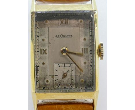 Jaeger-Lecoultre 14ct hallmarked gold ladies tank shape wrist watch, on Ostrich leather strap. 21mm diameter inc. button.  Gr