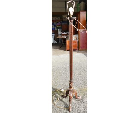 Victorian mahogany carved standard lamp with tripod base. 