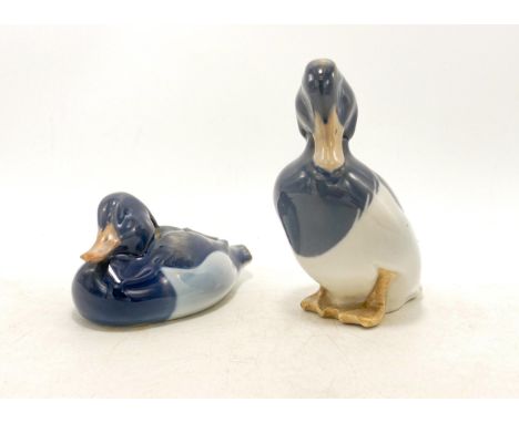 Royal Copenhagen model of a seated duck 1924 and standing duck 1941, h.12cm. (2) 