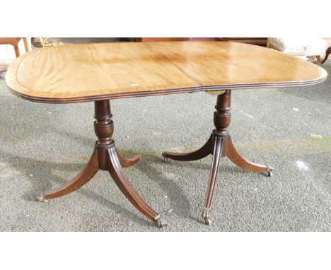 19th century mahogany D-end dining table on double tripod supports &amp; fitted with brass castors (no extra leaves) length 1