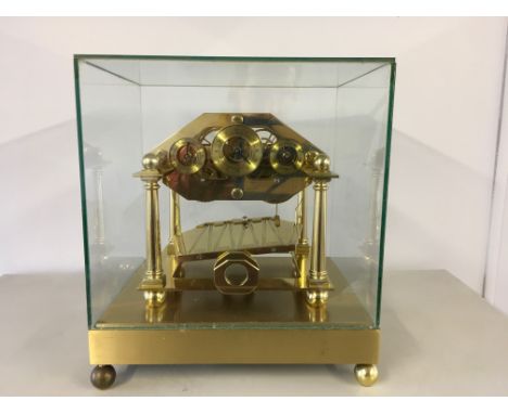 A REPRODUCTION WILLIAM CONGREVE ROLLING BALL CLOCK UNDER GLASS CASE WITH MAHOGANY PLINTH 
