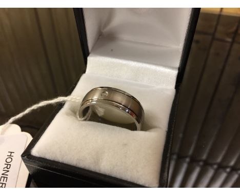 TITANIUM BAND RING, FROSTED FINISH TO MID SECTION WITH POLISHED EDGES. SET WITH A DIAMOND