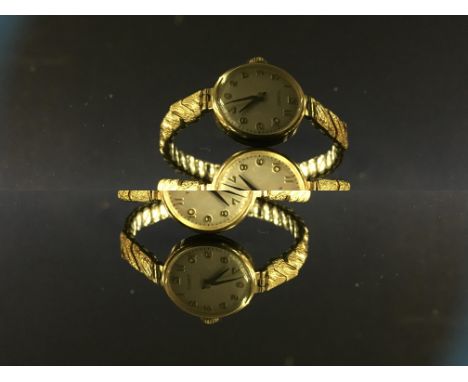 9CT. GOLD TISSOT LADIES WRIST WATCH ON PLATED EXPANDABLE BRACELET