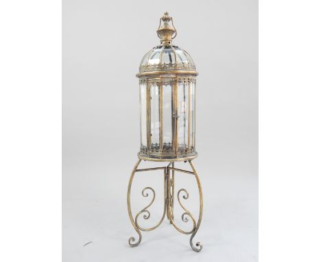 Italian style candle lantern, domed top, gilded finish and glass body, tri-arm scroll base, 107cm h.
