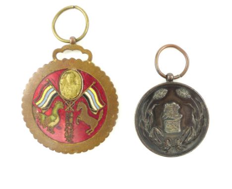 Manchukuo National Foundation Medal and another enamel medal in support of Manchu (2)