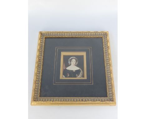 Unsigned British School, 19th C, portrait of a young lady with blue ribbon in her hair, watercolour, 9.4 x 7.6cm