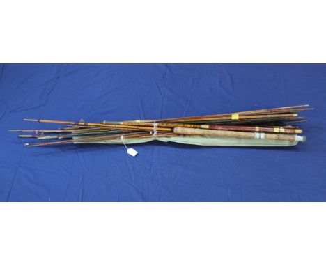 An assortment of vintage rods, butts, tips etc