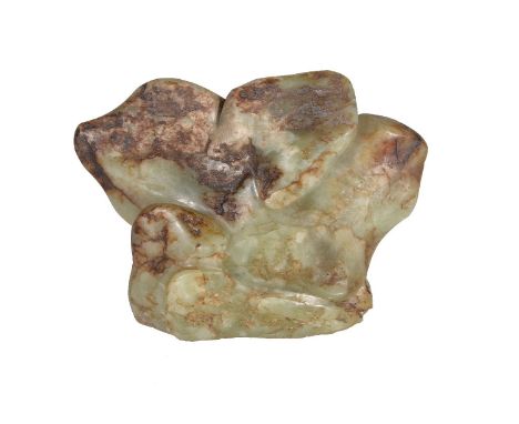 A Chinese green and russet jade 'Scholars Rock', 16cm wide x 12cm high x 6cm deep