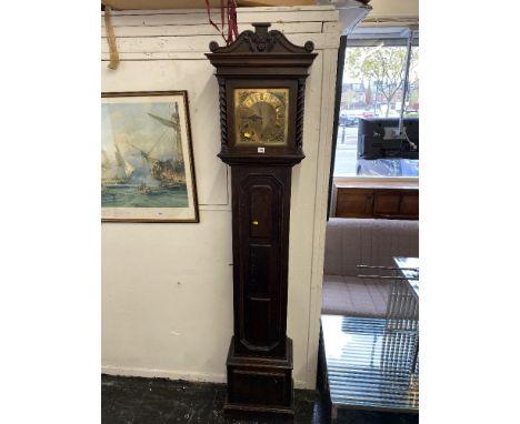 An Oak barley twist grandfather clock