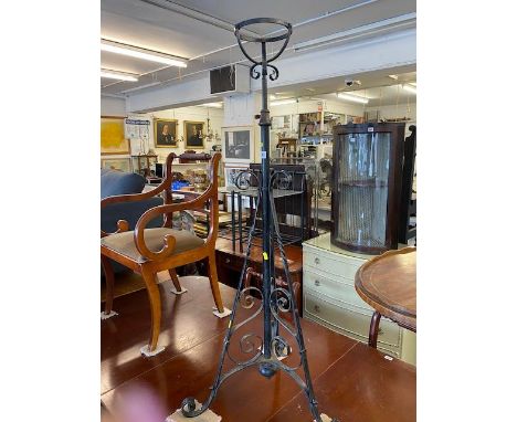 A Victorian wrought iron lamp stand