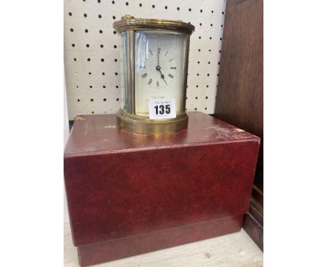 A boxed brass carriage clock