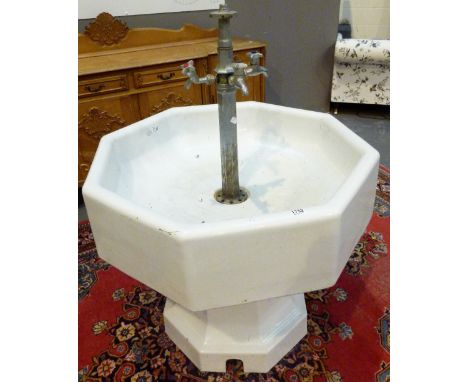 INDUSTRIAL FOUR TAP BASIN. Doulton pedestal ceramic wash basin with four tap fitting