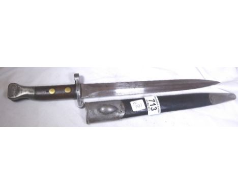 BRITISH MILITARY BAYONET. British military bayonet marked 97 with cross swords, probably Wilkinson, with leather and metal sc