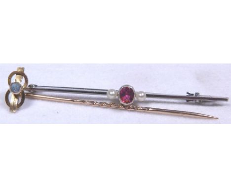 GOLD BAR BROOCHES. Two 9 ct gold bar brooches, white gold set with ruby and pearls and the other a horse shoe mounted tie pin