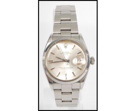 A vintage 20th century 1960's Rolex Oyster Perpetual Date wrist watch set to a stainless steel bracelet. The silvered dial wi