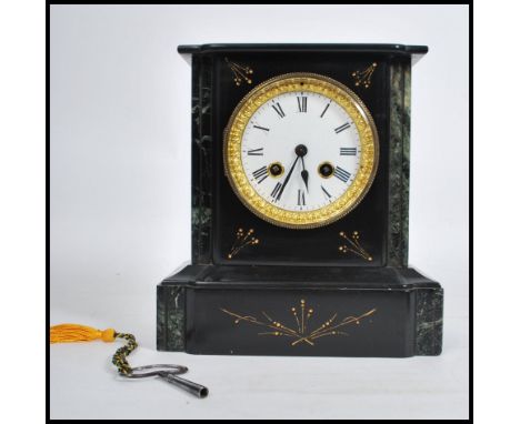 A 19th century Victorian marble and slate mantel clock, eight day movement striking on a bell. Roman Numeral chapter ring&nbs