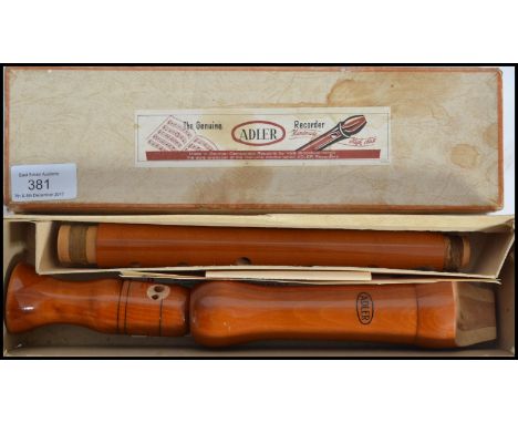 A vintage Adler three piece wooden recorder musical instrument complete in original box with applied label reading The Origin