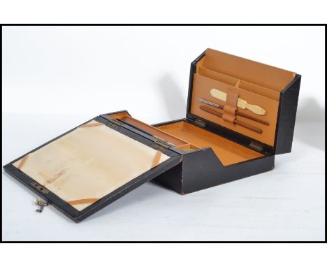 A 19th century Victorian leather travelling writing slope desk tidy compendium box by Farrant's of Leeds. Complete with inkwe