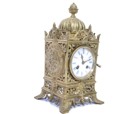 A 19th century French gilt brass mantel clock. The clock having an day movement striking on a bell being set within a good br