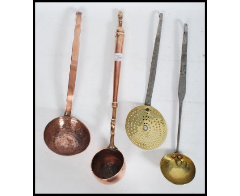 An 18th / 19th century brass water / toddy ladle, possibly naval in origin, turned handle riveted to&nbsp; large worked bowl,