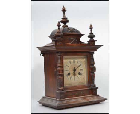 An early 20th century German mantle clock, eight day movement striking on a bell, J. Unghans, brass dial, black Roman numeral