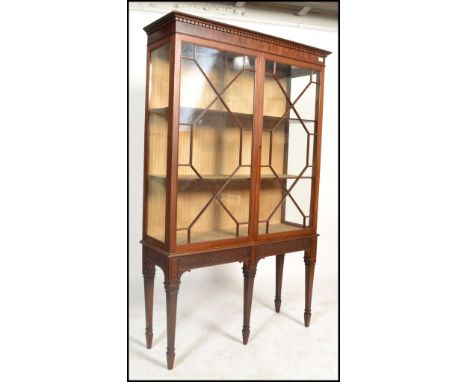 An Edwardian mahogany chippendale revival large&nbsp; display cabinet. Raised on square tapered legs with spade feet supporti