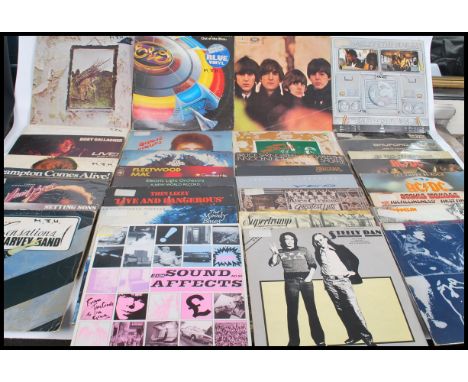 Vinyl Records - A collection of vinyl long play LP record albums to include Led Zeppelin on pink vinyl, ELO on blue vinyl, Th