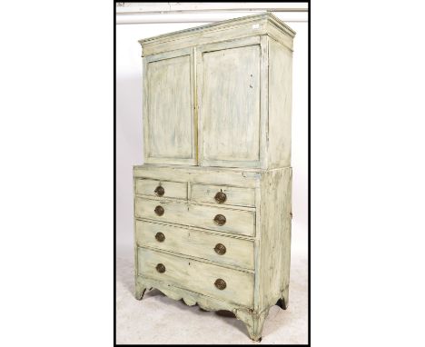 A 19th century shabby chic country cabinet on chest of drawers / dresser. Raised on bracket feet with a series of short and d