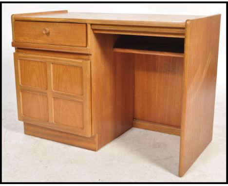 A retro 1970's Nathan furniture teak wood pedestal desk. The open kneehole recess flanked by a qtr panel door cupboard.&nbsp;