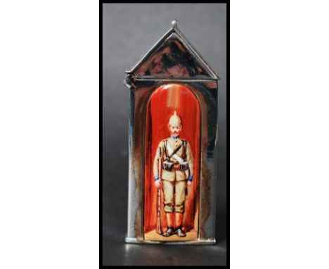 An unusual sterling silver vesta case in the form of a century box having enamel painted plaque depicting an officer in unifo