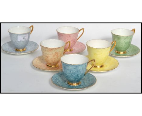 A set of six Royal Albert Gossamer tea cups&nbsp;each with matching saucers. Elegant form with gilt banding to handles and un