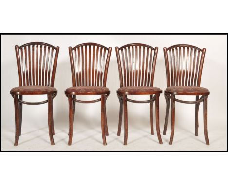 A set of 4 contemporary - retro style bentwood cafe chairs raised on turned legs with panel seats and slatted shaped back res