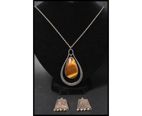 A silver and tigers eye large pendant necklace having a rope twist chain with bolt ring clasp. Also with a pair of sterling s