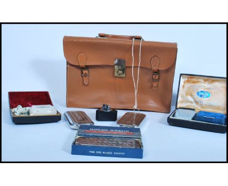 A collection of vintage 20th century razors to include three metal cased Rolls razors, Ronson lighter and shaver, along with 