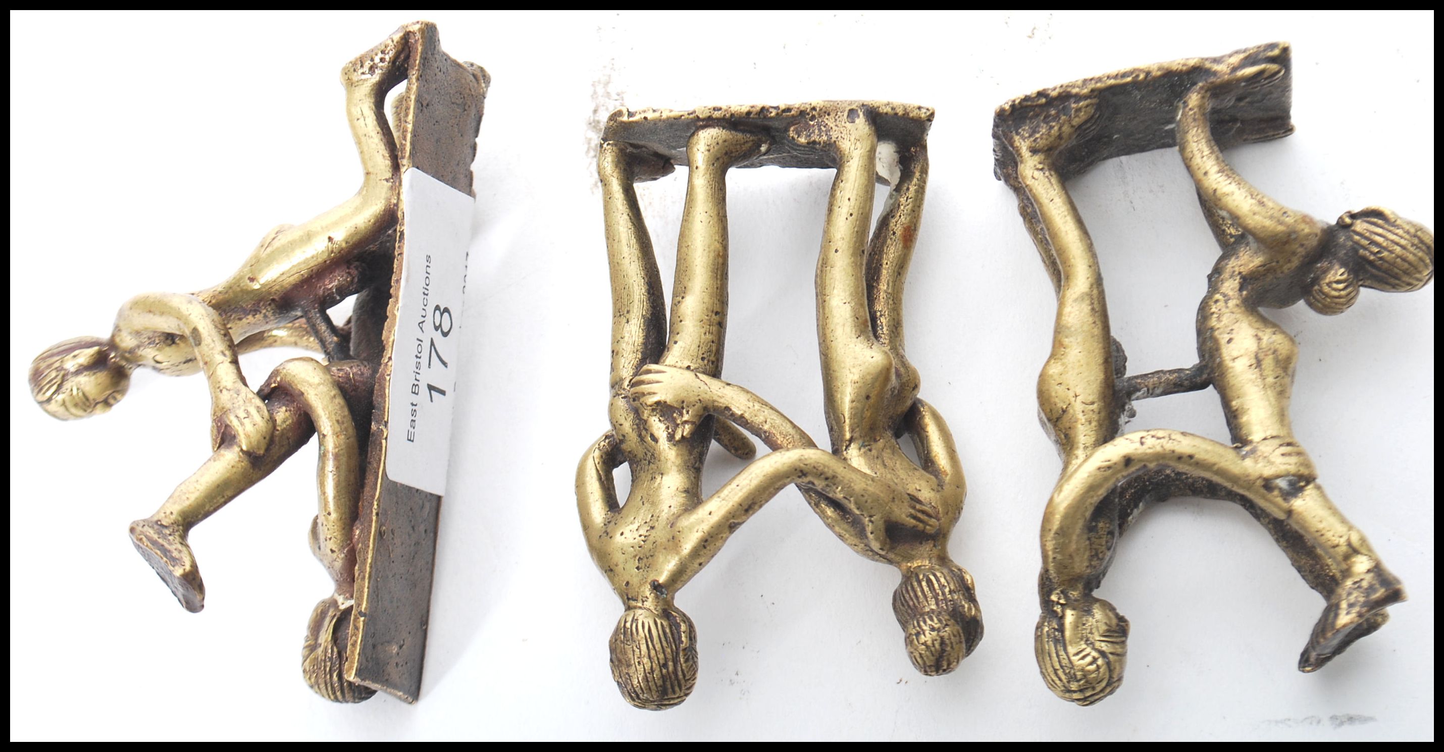 A group of three vintage 20th century Indian Kamasutra cast brass figurines of couples in various