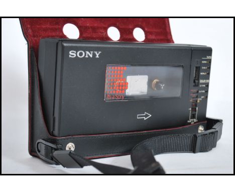 A retro 20th century Sony walkman professional, model no WM-D6C stereo cassette recorder being complete with the original lea