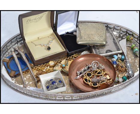 A collection of vintage silver and costume jewellery to include a silver bracelet, charm bracelets, charms, Miracle brooch, S