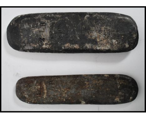 Two vintage horse racing equestrian jockey riders handicap lead weights to include a 1lb and a 2lb example. Both with stamped