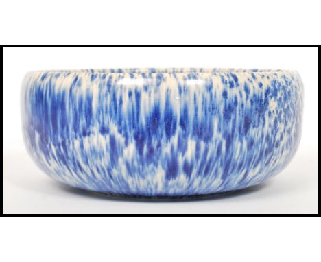 A vintage 20th century blue crystal line half fire glaze bowl in the manner of Ruskin pottery. Measures 10 cm high and 23 cm 