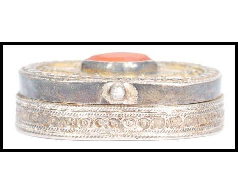 A vintage Kazakhstan silver gilt and Carnelian snuff box from Russian central Asia, fitted with a hinged gilt decorated lid, 