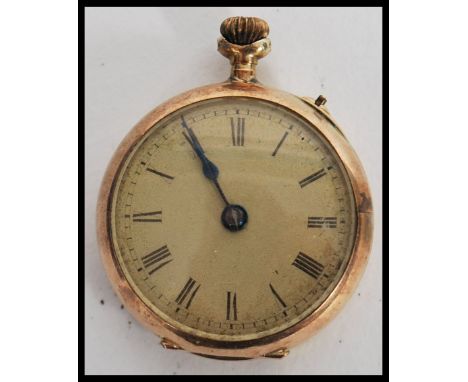 A vintage 20th century ladies 9ct gold cased pocket watch, white enamel dial with roman numeral chapter ring with top winder.