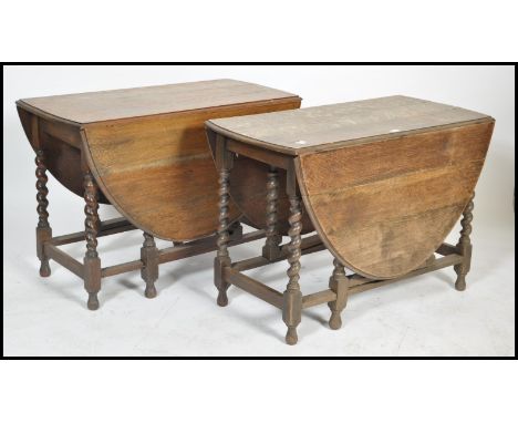 A 1930's oak barley twist drop leaf / gate leg action dining table together with another similar. Both with barleytwist legs 