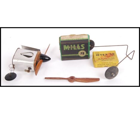 A vintage Mills Diesel .75 model aeroplane engine. Assembled with spare parts within the original box.&nbsp;