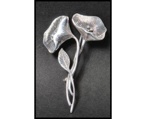 A 925 silver Art Nouveau style figural brooch in the form of&nbsp; a flower spray&nbsp; having a roller clip clasp. Measures 