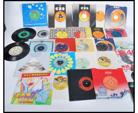 Vinyl Records - A collection of 45rpm vinyl 7" singles featuring various artists to include Peter Tosh, The Who, The Police, 