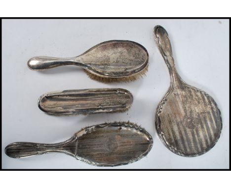 A group of silver hallmarked brushes and mirrors to include engine turned pair. Please see images.