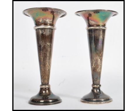 A pair of silver hallmarked candlestick vases by&nbsp;Edward Barnard &amp; Sons Ltd, Birmingham 1944.&nbsp;