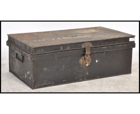 A 19th century ebonised military tin trunk with hinged top bearing notation for Captain Sheppard.&nbsp;Measures 28cm x 76cm x
