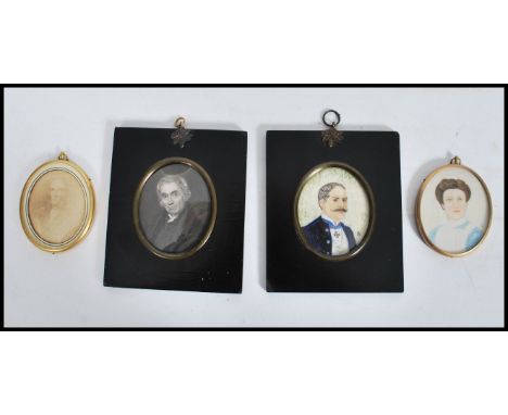 A group of four miniature pictures in various mediums to include two oval gilt framed pictures of females and two ebonised fr